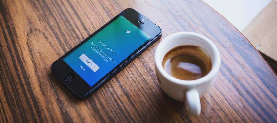 twitter next to coffee cup