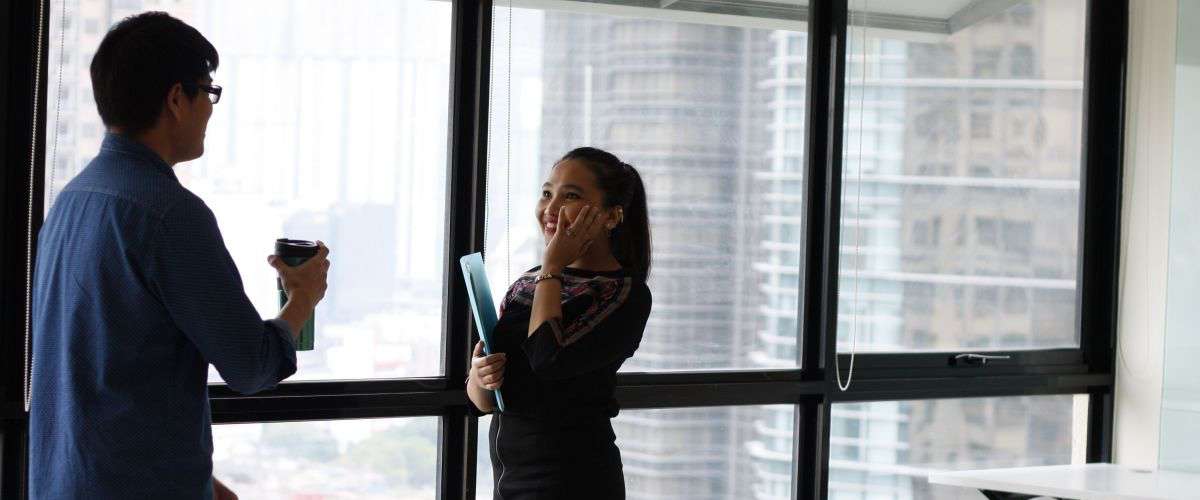 woman building leads at trade show